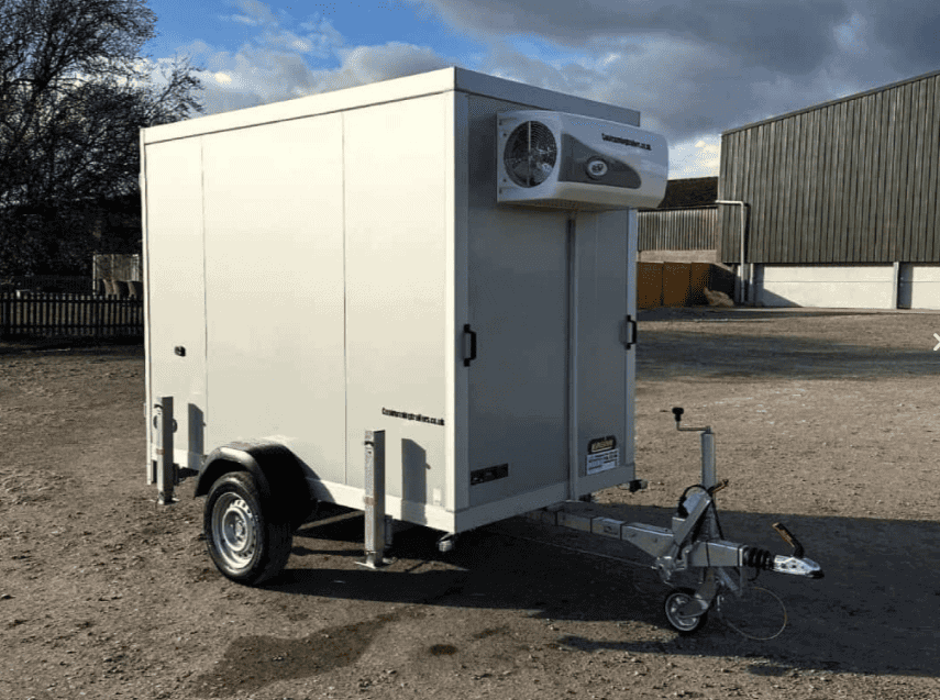 A compact 2.5m refrigerated trailer parked in a paved courtyard, shown in a clean, professional setting.